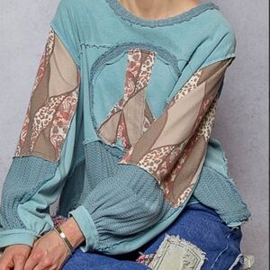2889. NEW POL Long Sleeve Peace Emblem Top in Pale Blue